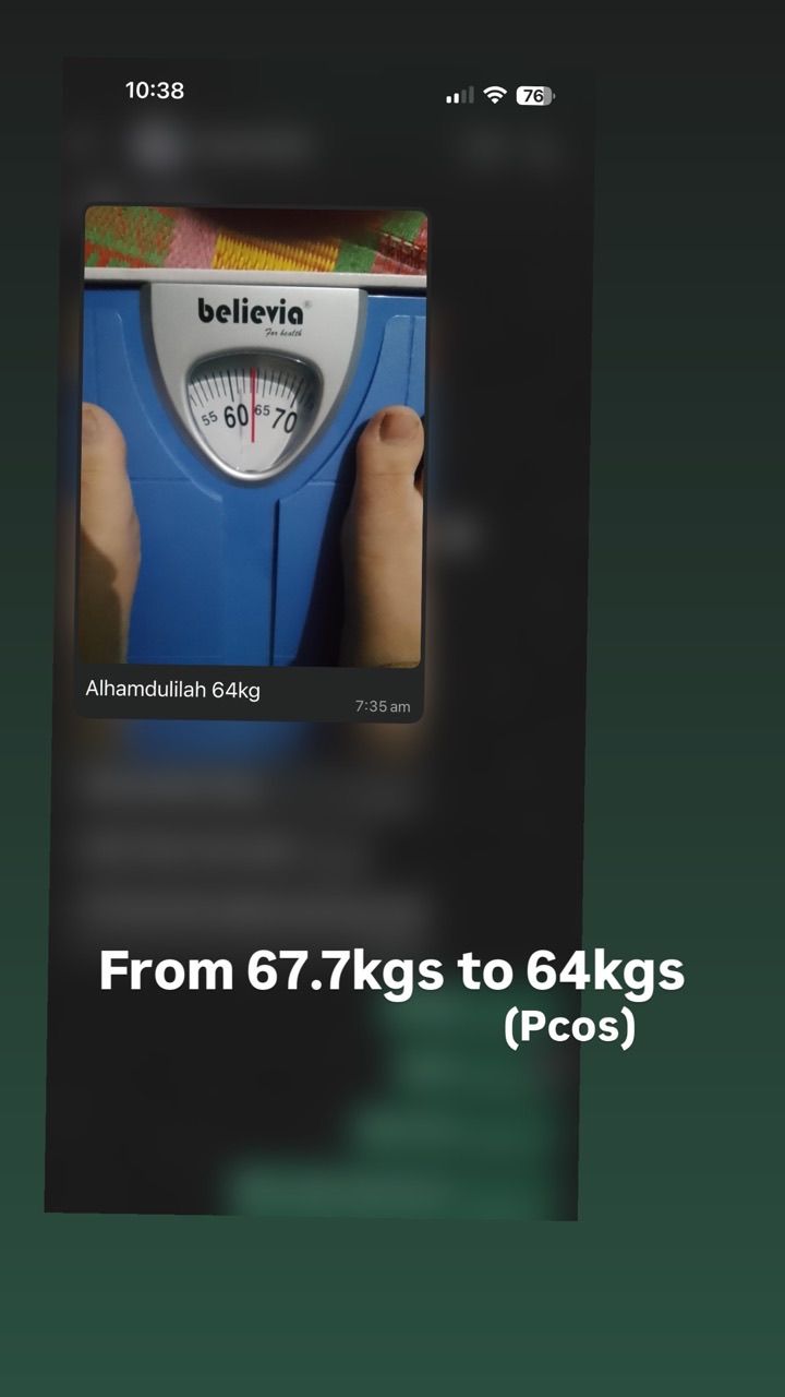 A weighing scale photo shared by a client managing PCOS, showing a drop from 67.7kg to 64kg
